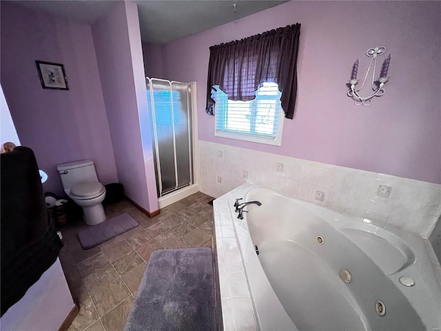 bathroom featuring plus walk in shower and toilet