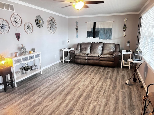 living room featuring ceiling fan, a healthy amount of sunlight, and wood-type flooring