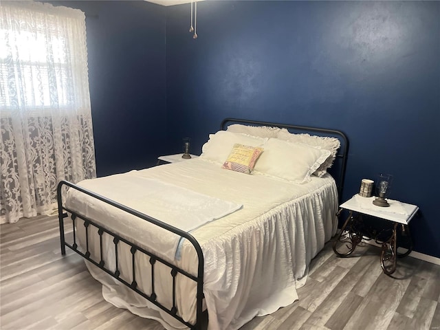 bedroom featuring wood-type flooring