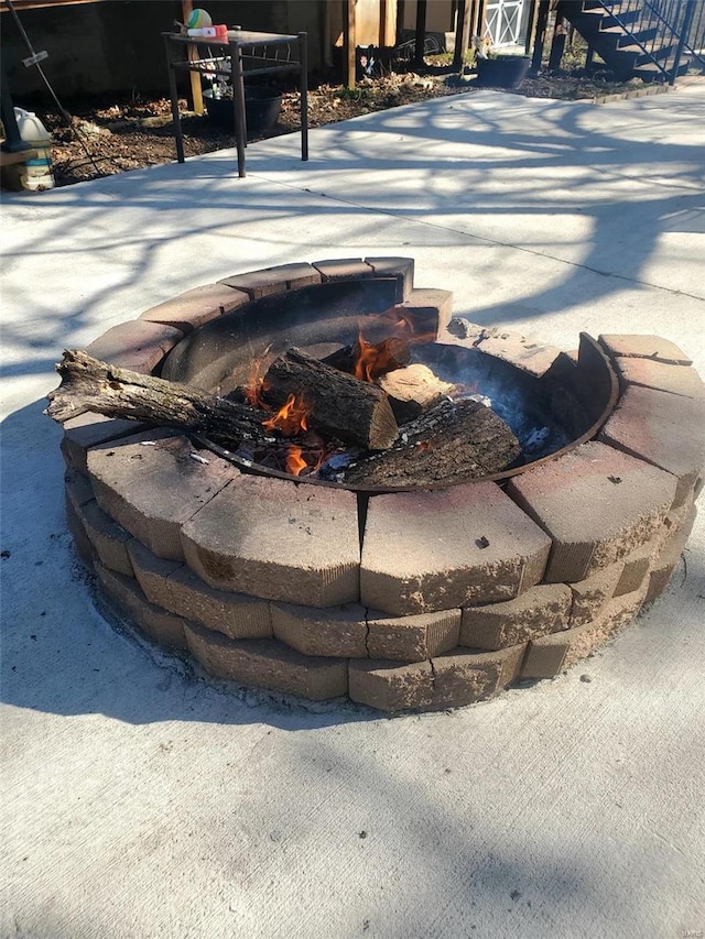 exterior details with an outdoor fire pit