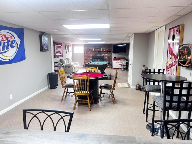 dining area with a paneled ceiling