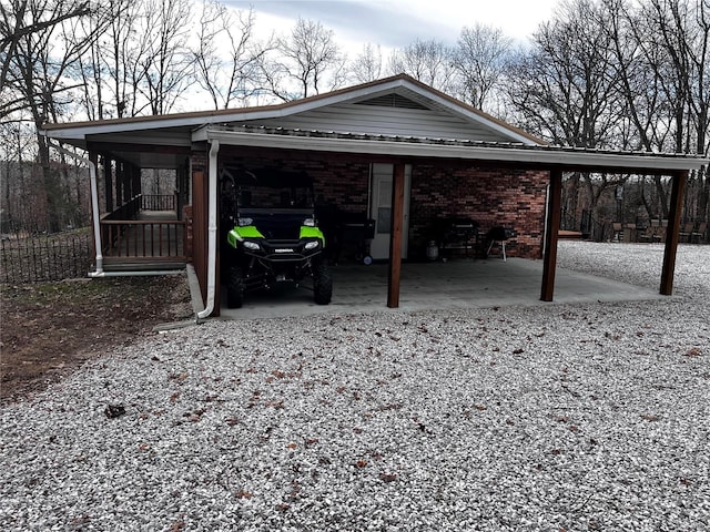 view of vehicle parking with a carport