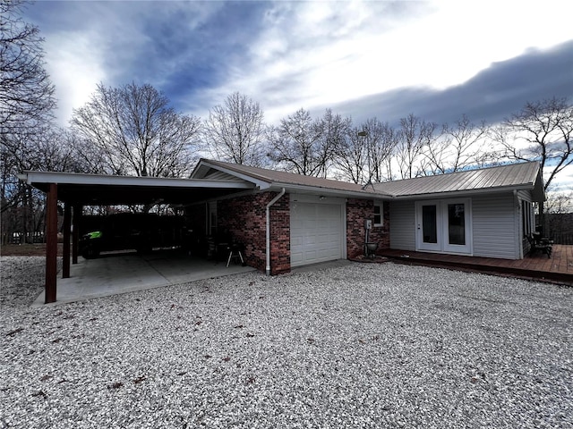 single story home featuring a carport and a garage