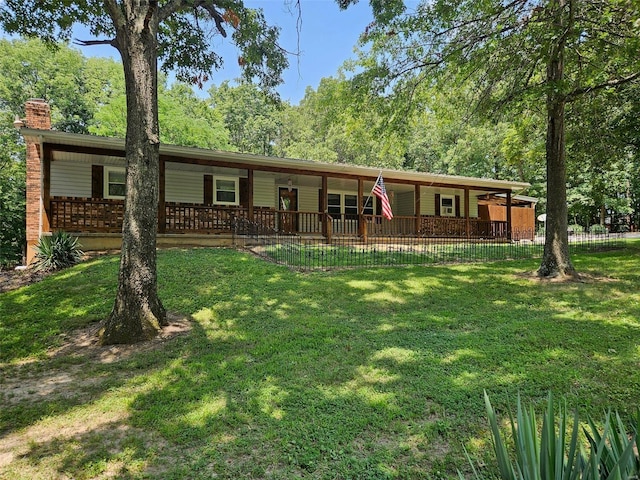 ranch-style home featuring a front yard