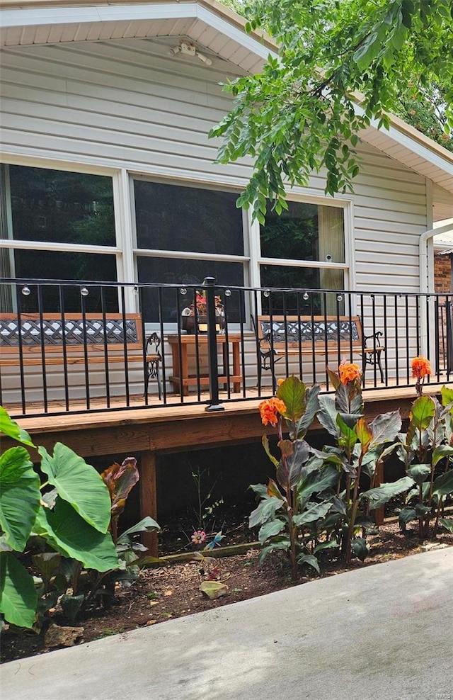 wooden deck featuring a sunroom