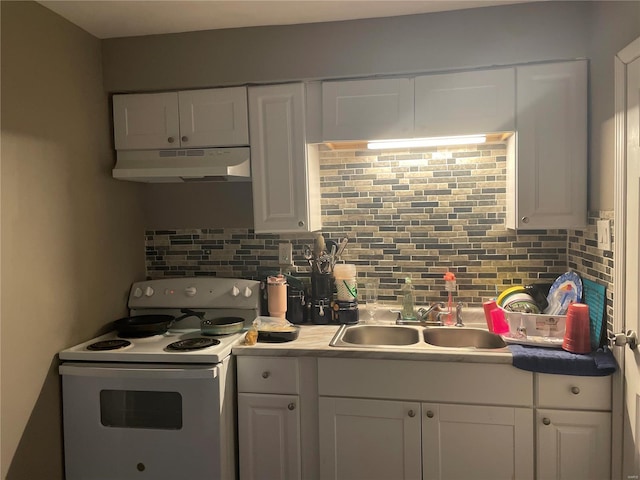 kitchen featuring white electric range oven, decorative backsplash, white cabinets, and sink