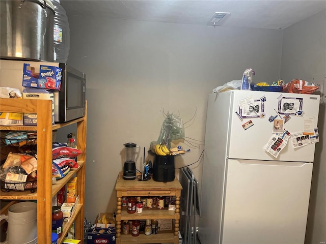 interior space featuring white refrigerator