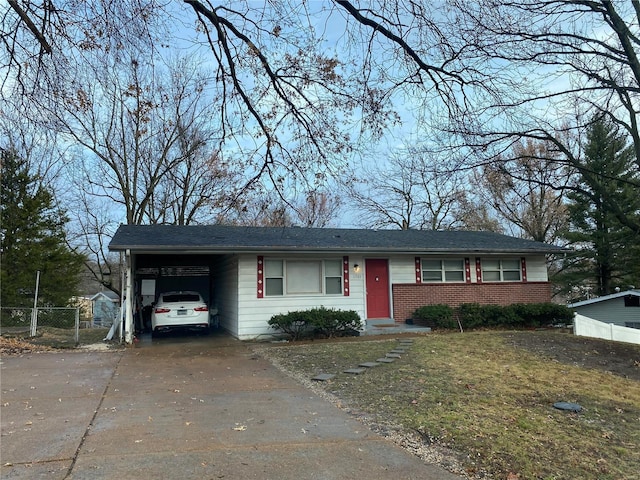 single story home featuring a carport and a front yard