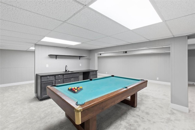 game room with a paneled ceiling, light colored carpet, sink, and pool table