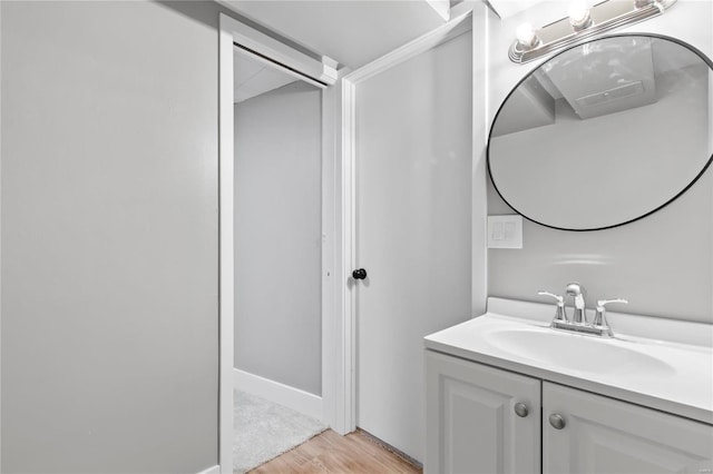 bathroom featuring vanity and hardwood / wood-style flooring