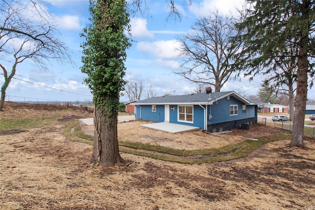 rear view of house featuring a patio