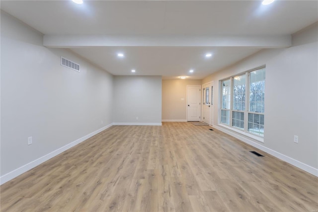 interior space with beamed ceiling and light hardwood / wood-style floors