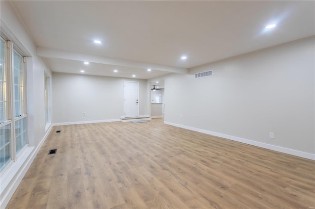 interior space with ceiling fan and light hardwood / wood-style floors