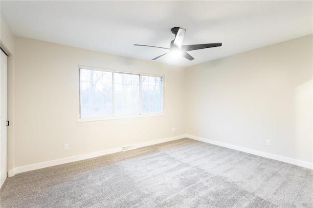 interior space featuring ceiling fan and light carpet