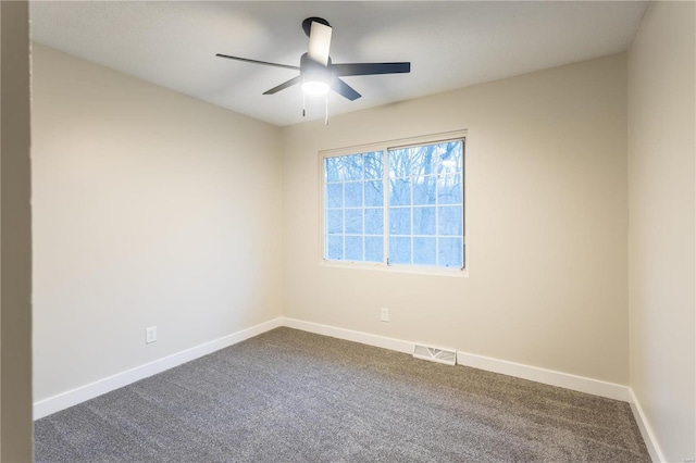 spare room with carpet flooring and ceiling fan