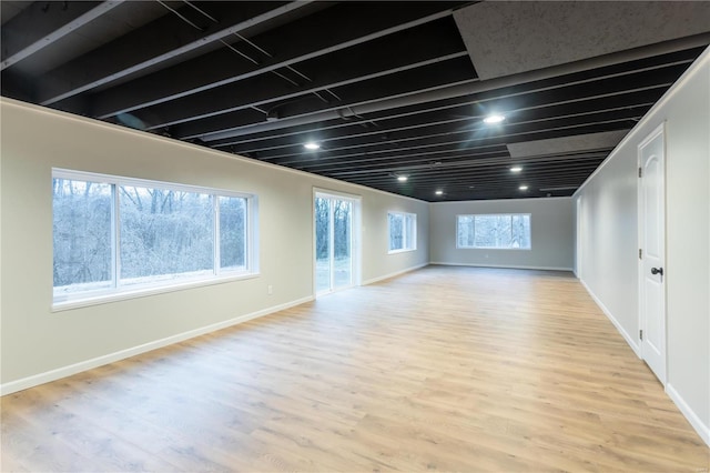 basement featuring light hardwood / wood-style floors