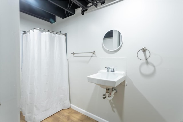 bathroom featuring wood-type flooring