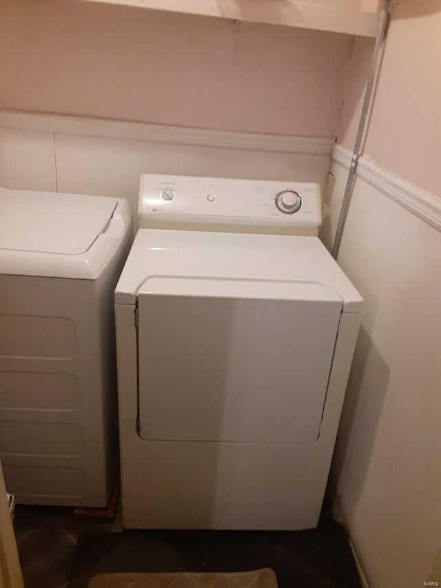 laundry area featuring washing machine and clothes dryer