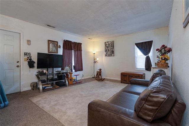 living room featuring light carpet