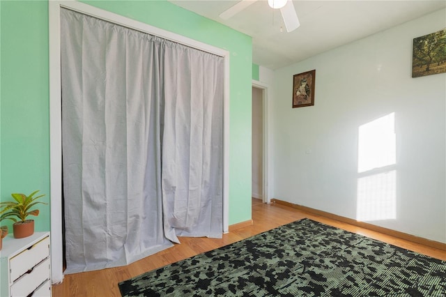 bedroom with ceiling fan and light hardwood / wood-style flooring