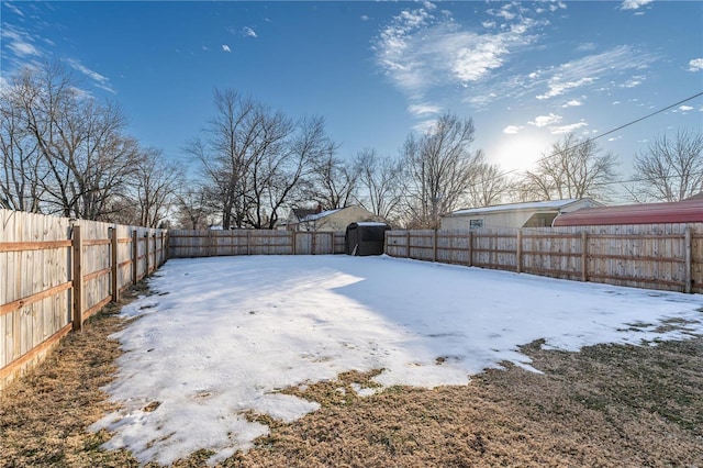 view of yard layered in snow