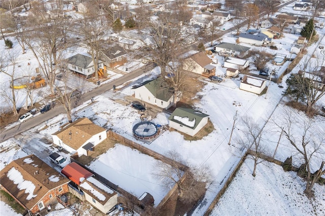 snowy aerial view with a residential view