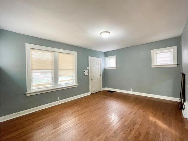 foyer with wood-type flooring