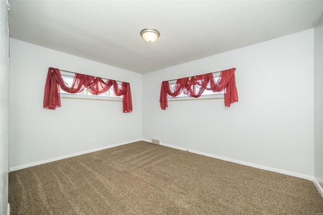 empty room featuring carpet flooring