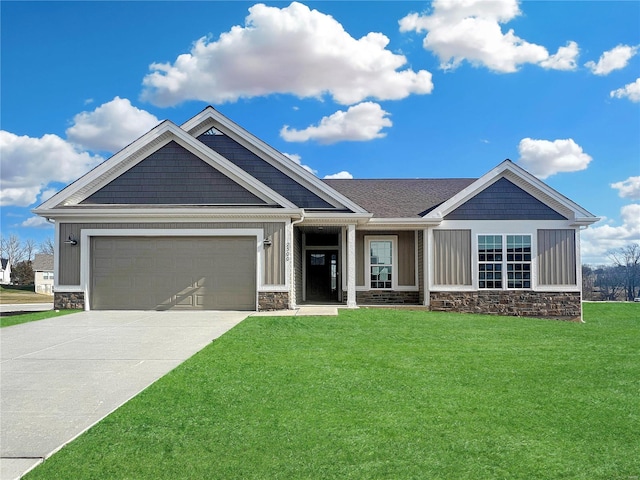 craftsman inspired home featuring a front yard and a garage