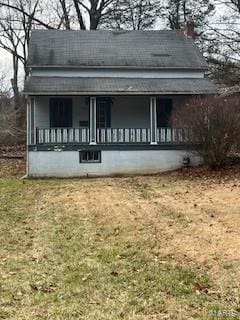 exterior space with a front yard and a porch