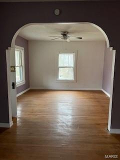 empty room featuring hardwood / wood-style floors and ceiling fan