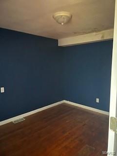 unfurnished room with hardwood / wood-style floors