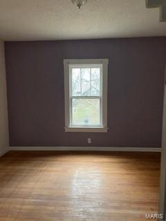 spare room with light wood-type flooring