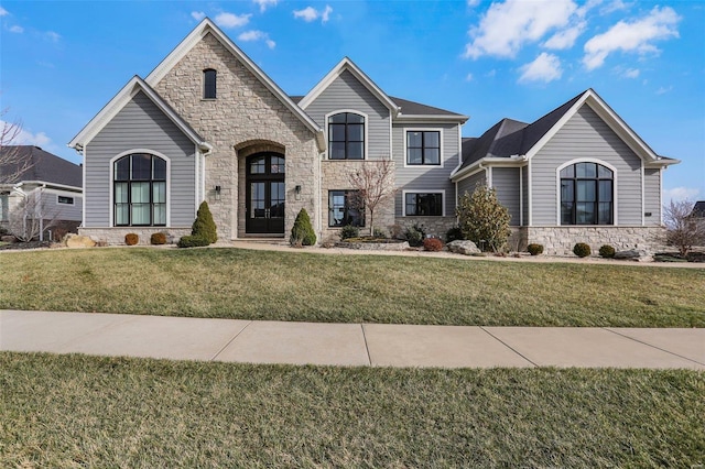 view of front of home with french doors and a front yard