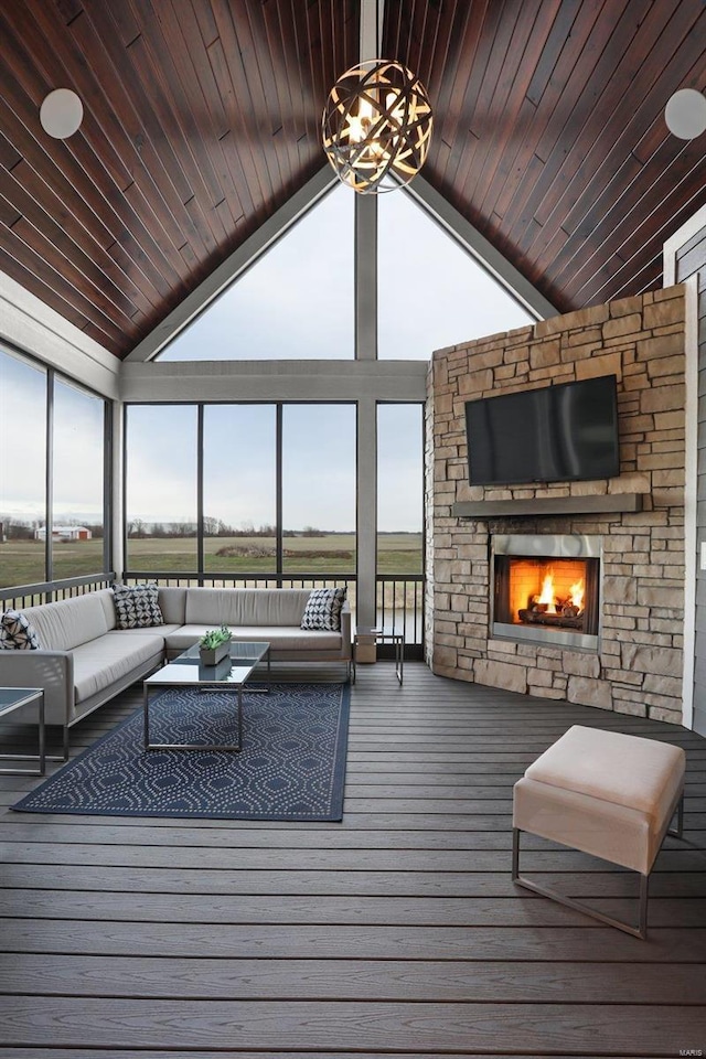 interior space with an outdoor living space with a fireplace