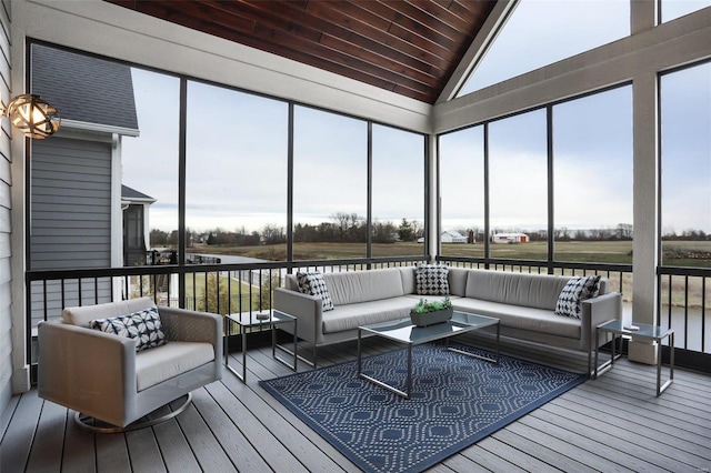 sunroom featuring a wealth of natural light and vaulted ceiling