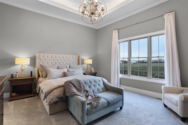 bedroom with a raised ceiling, crown molding, carpet floors, and a chandelier