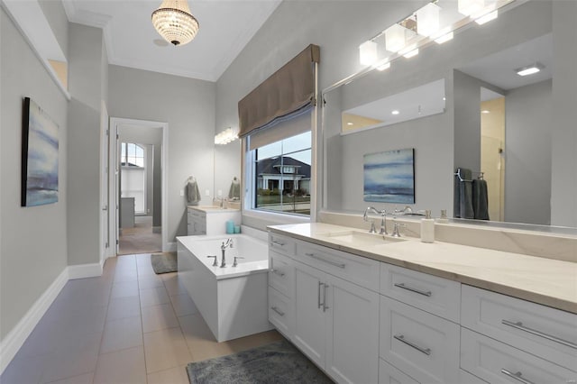 bathroom with tile patterned floors, crown molding, vanity, and a bath