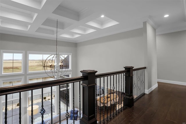 hallway with a chandelier, beam ceiling, dark hardwood / wood-style floors, and coffered ceiling