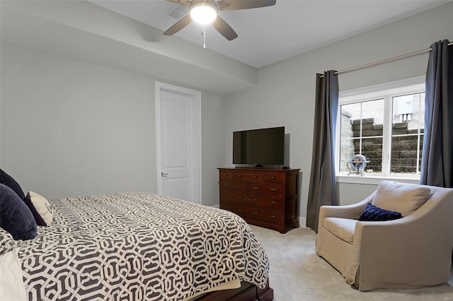 bedroom featuring ceiling fan and light colored carpet