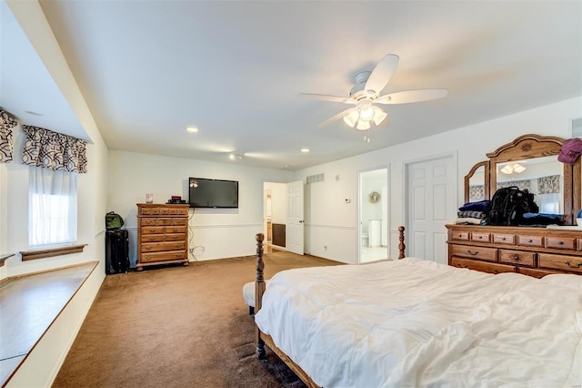 bedroom featuring ensuite bathroom, ceiling fan, and carpet flooring