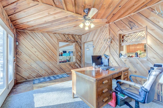 home office with wood walls, ceiling fan, and wooden ceiling