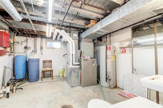 basement with gas water heater and heating unit