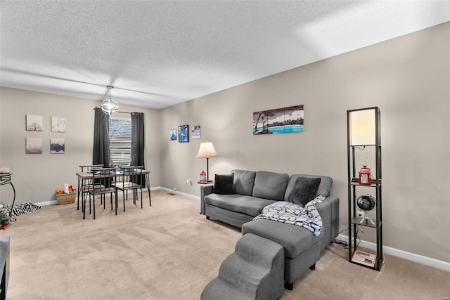 carpeted living room with a textured ceiling