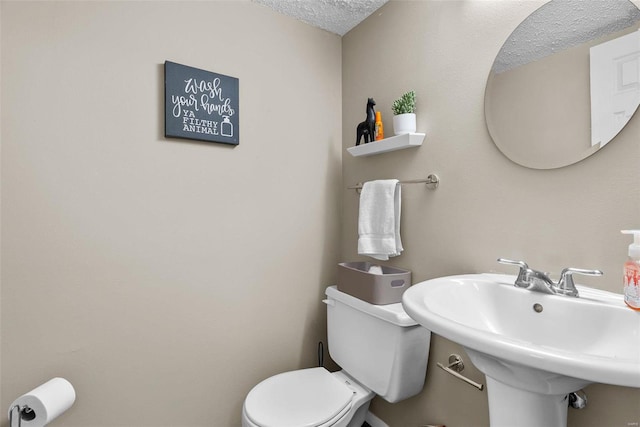 bathroom featuring sink and toilet