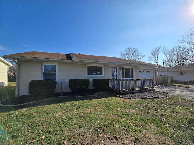 single story home with a garage and a front lawn