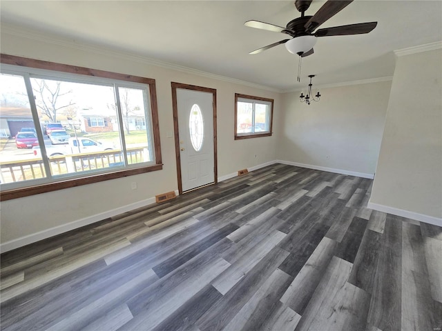 entrance foyer featuring ceiling fan with notable chandelier, dark hardwood / wood-style flooring, and ornamental molding