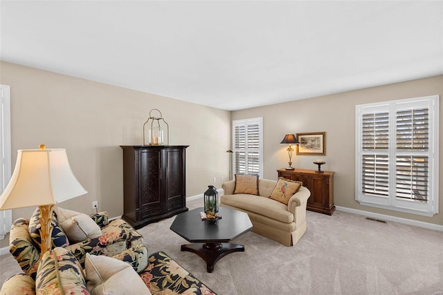 living room featuring light carpet