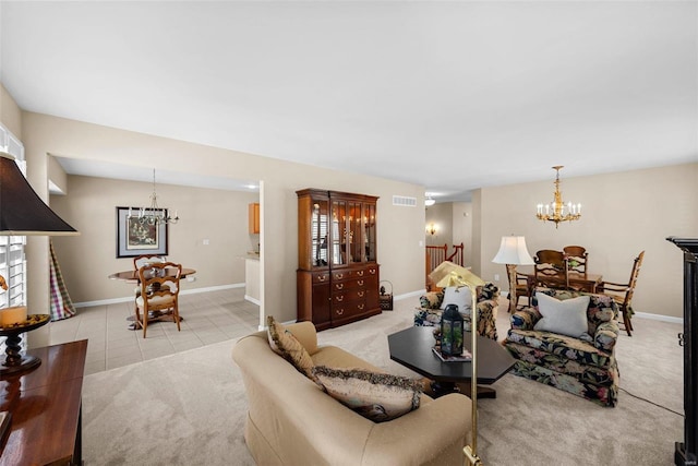 living room featuring light carpet and a chandelier