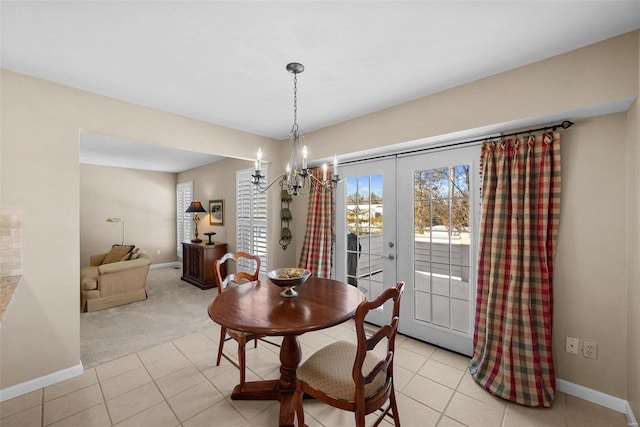 dining room featuring light carpet